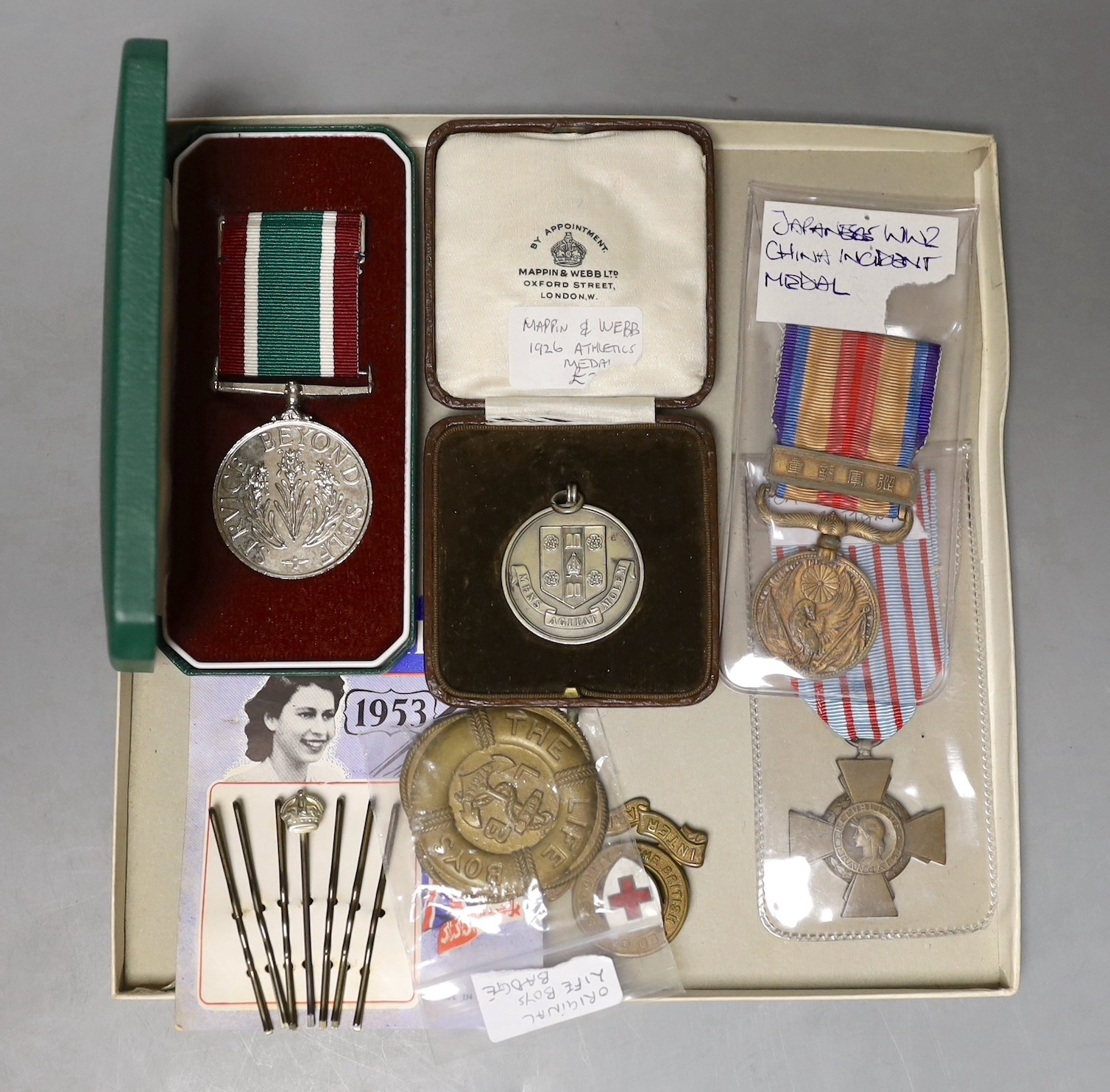 A WWI French Croix du Combattant medal, WWII Japanese China incident medal, other medals, badges, etc.